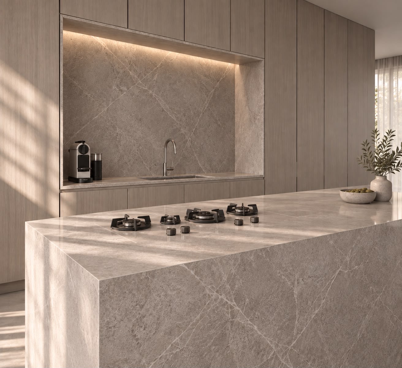The stone island at an angle with a gas cooktop, the lit niche and bands of sunlight on the worktop. Render.