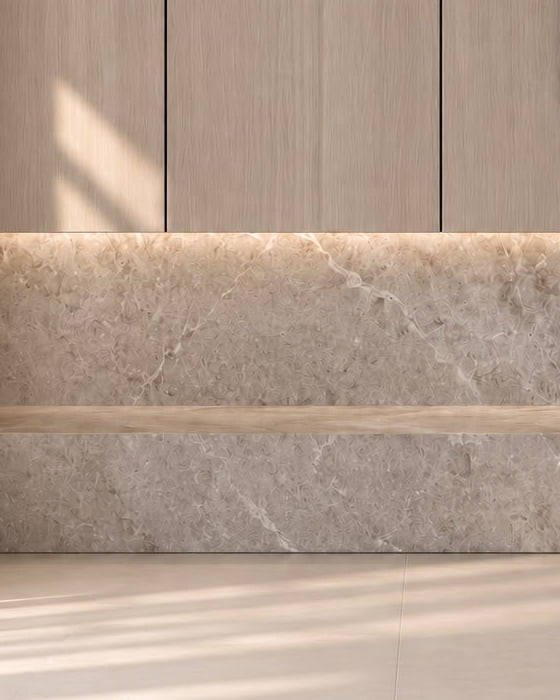 A detail: a warm line of light between the oak paneling and the stone plinth. Render.